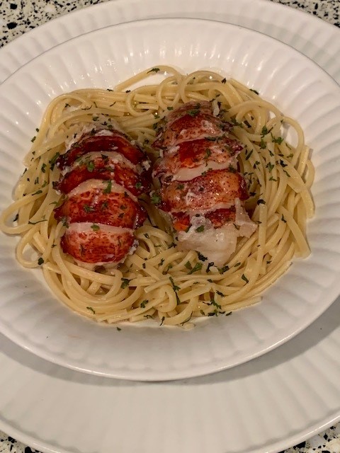 Butter poached lobster on linguine with lobster butter sauce